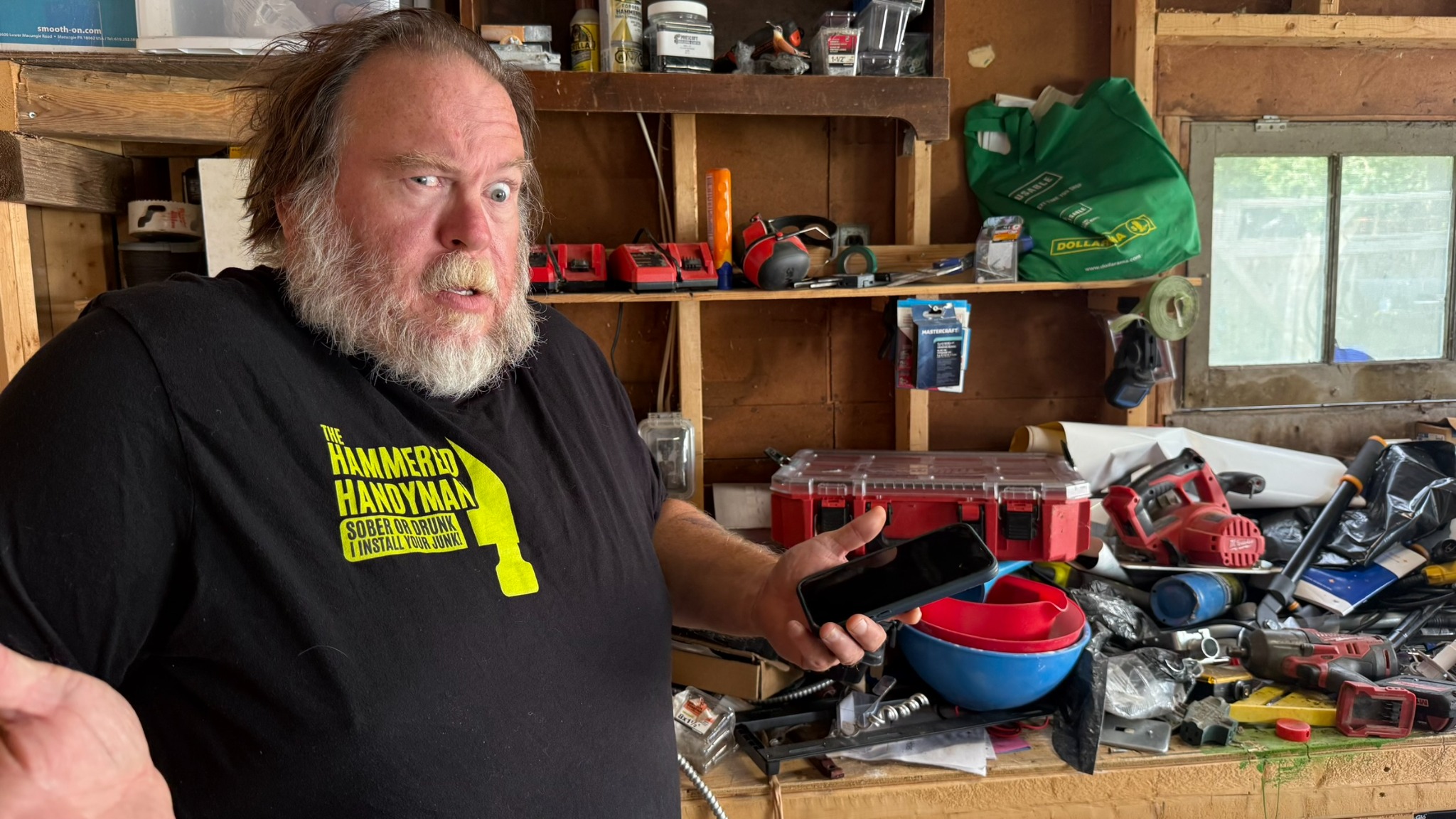 The Hammered Handyman in his workshop, reacting to a project